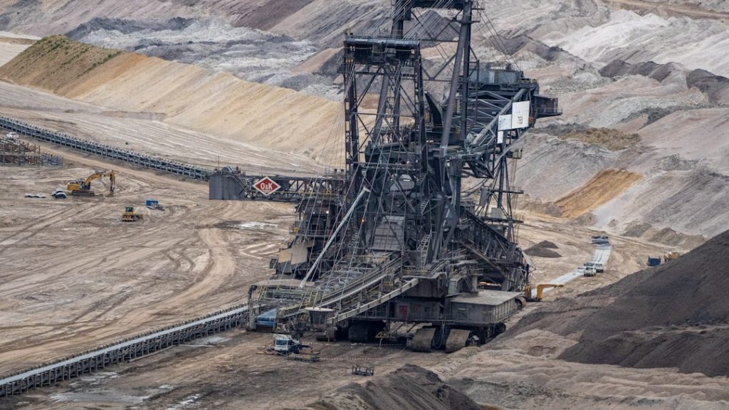 The sacrificial Site of the fossil Age -

Opencast lignite mining at Hambach, Germany